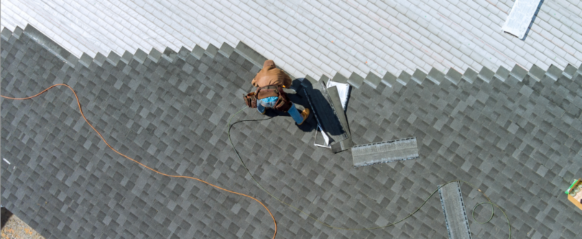 Roof workers repairing a residential roof