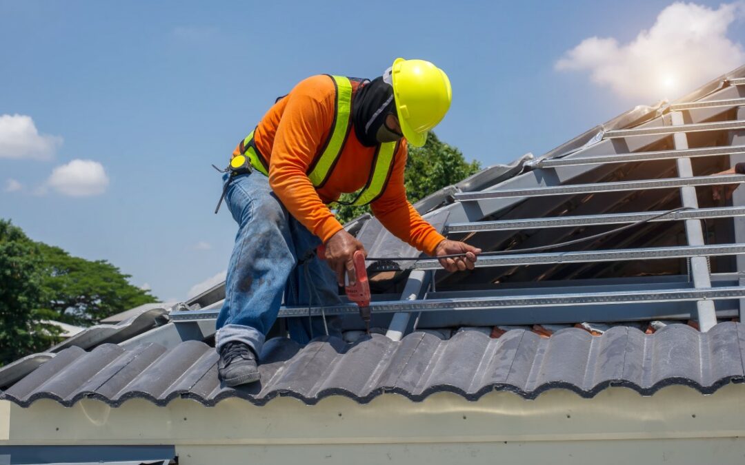 Homeowner reviewing roof replacement cost breakdown with roofing expert