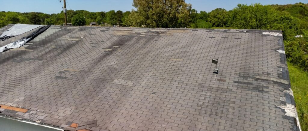 damaged asphalt shingles