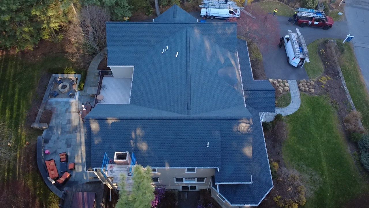 A close-up view of asphalt shingles on a residential roof.