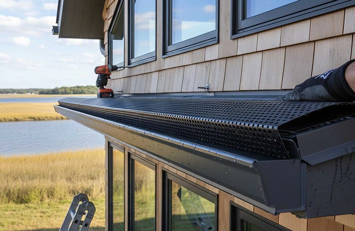 Massachusetts home exterior with a gutter guard system installed