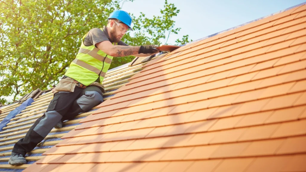 GAF-certified roofer inspecting a Massachusetts roof before hurricane season