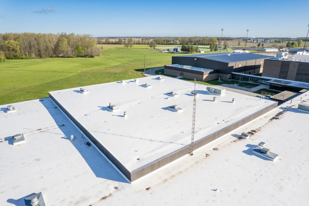 Wide aerial or close-up photo of a commercial TPO EPDM flat roof